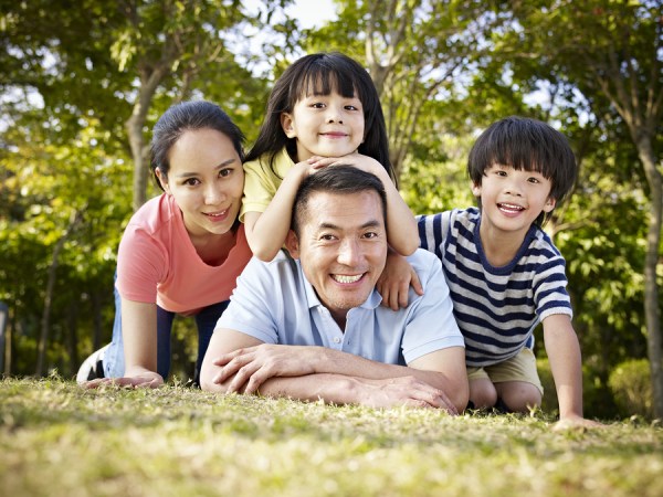 Happy Asian Family With Two Children